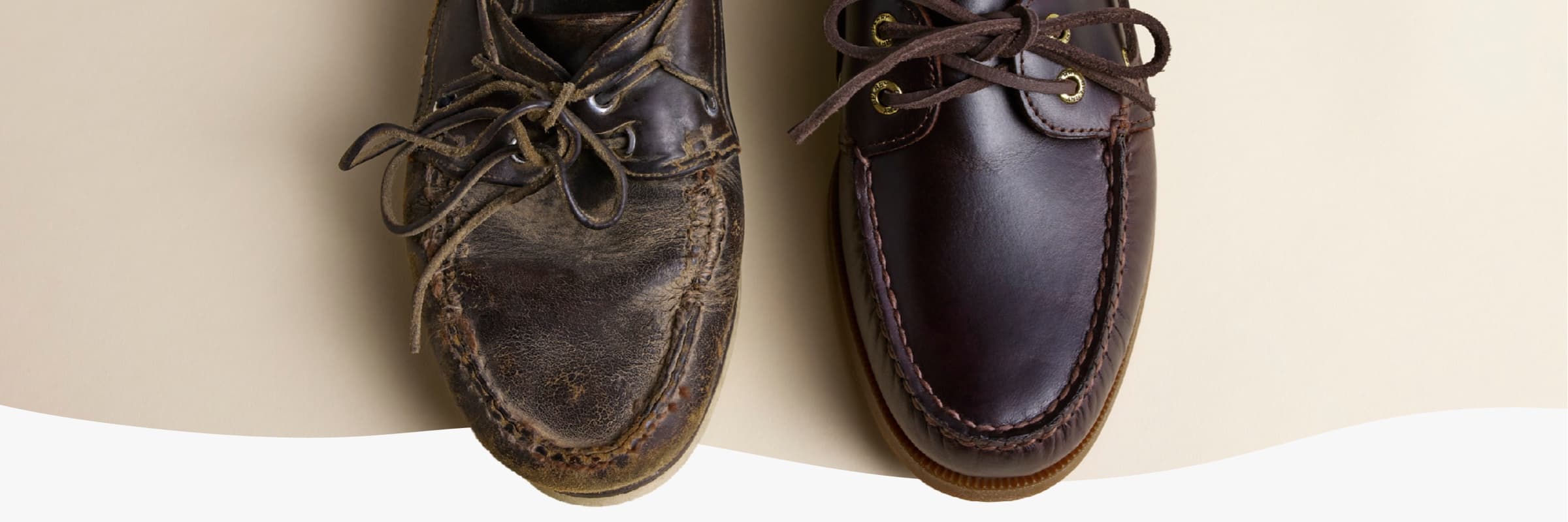 Side-by-side top-down view of two Sperry leather boat shoes — one heavily worn with creased and weathered leather, the other in new condition with smooth dark burgundy leather, highlighting the contrast between aged and new.