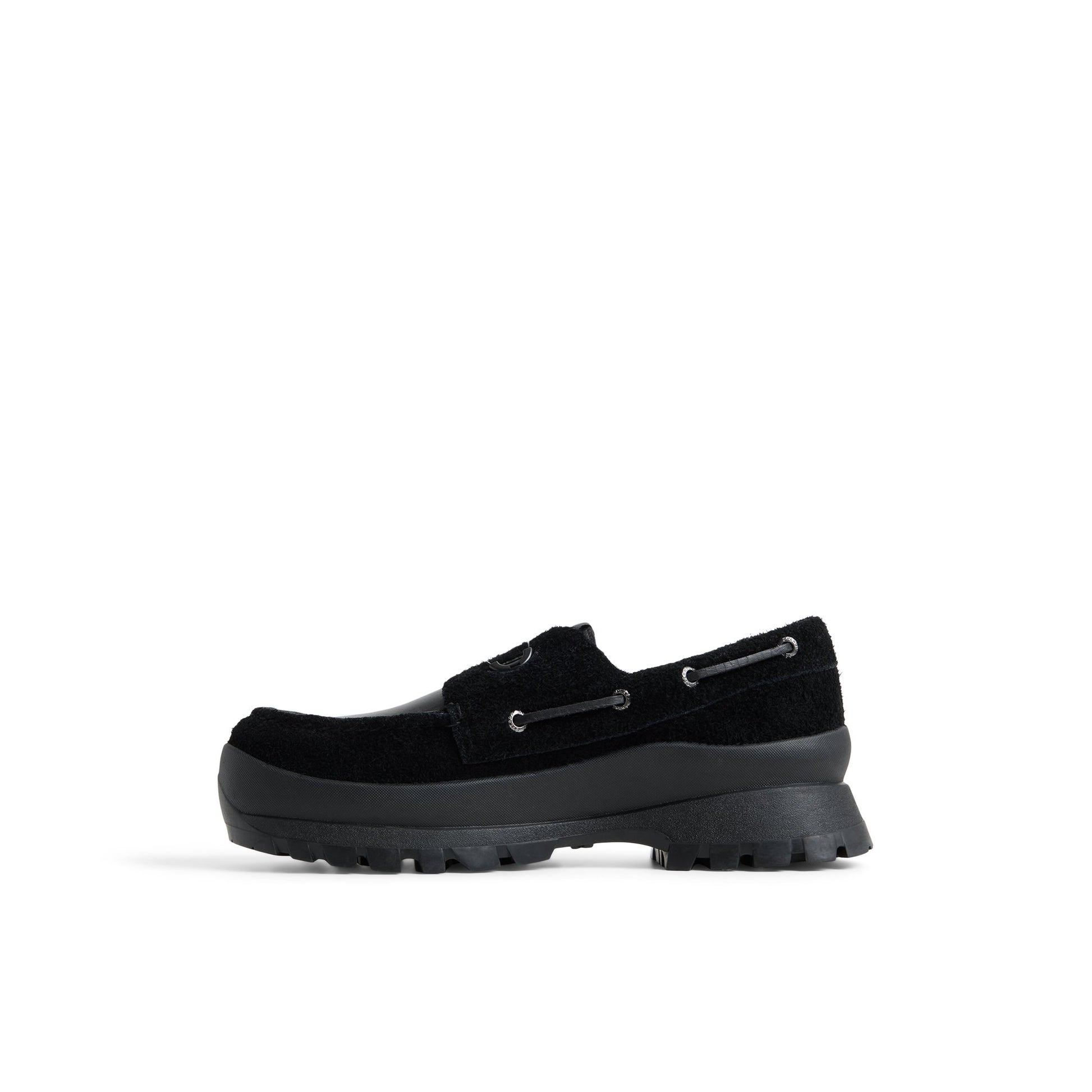 Three-quarter angle of Black Sperry x Pleasures 3-Eye Vibram Turn-Lock Lug Boat Boat Shoe's back side