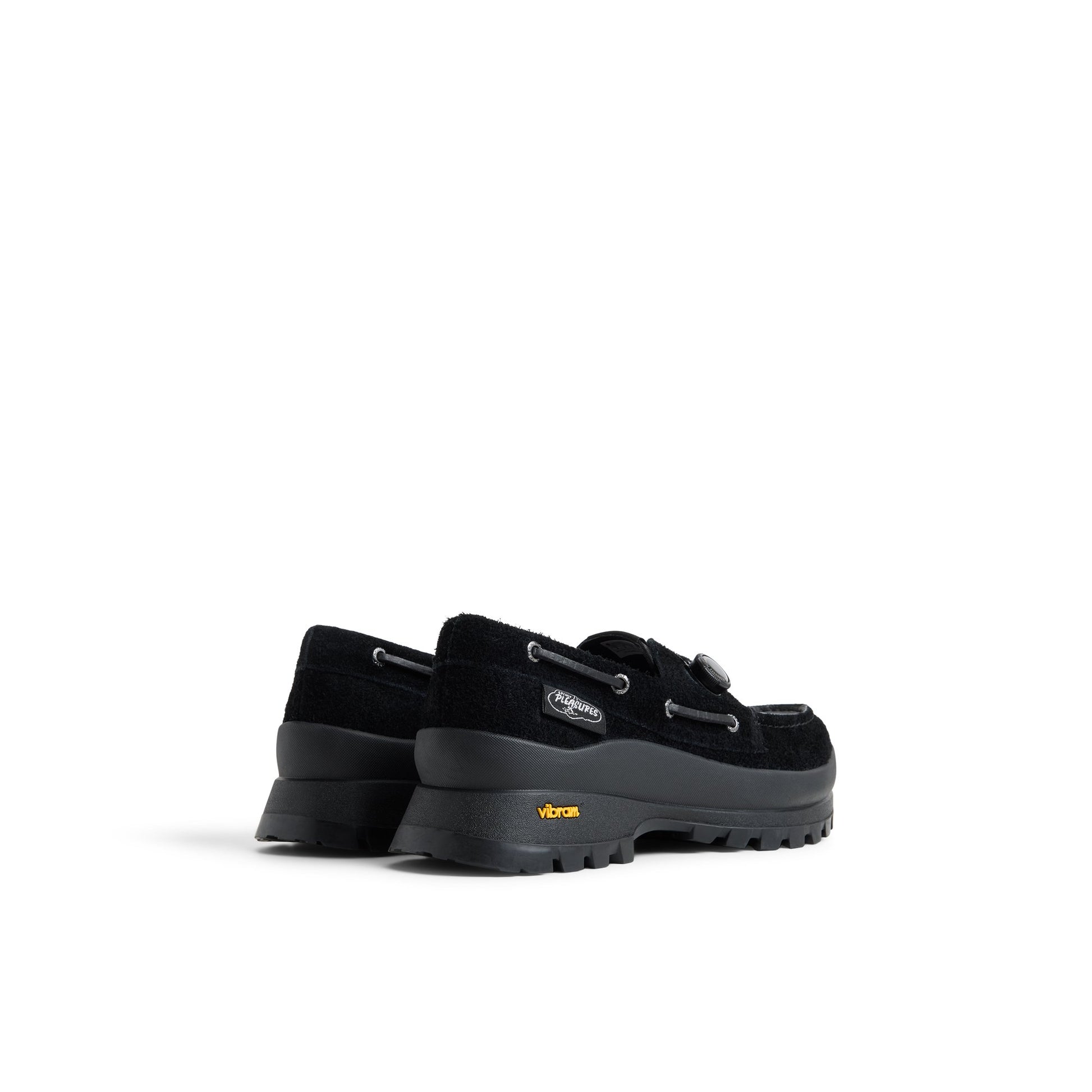 Three-quarter angle of Black Sperry x Pleasures 3-Eye Vibram Turn-Lock Lug Boat Boat Shoe's front side