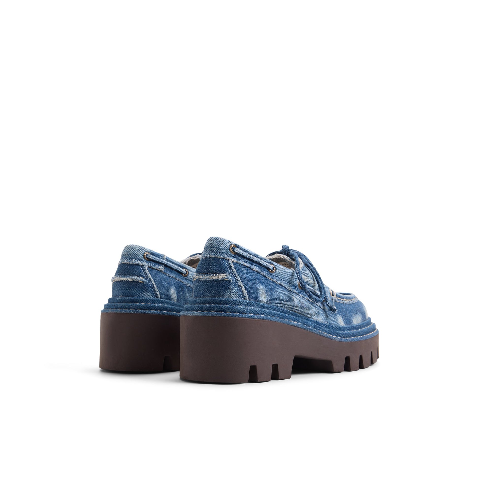 Three-quarter angle of Denim Sperry x MONSE Authentic Original™ 2-Eye Lug Boat Shoe 's front side