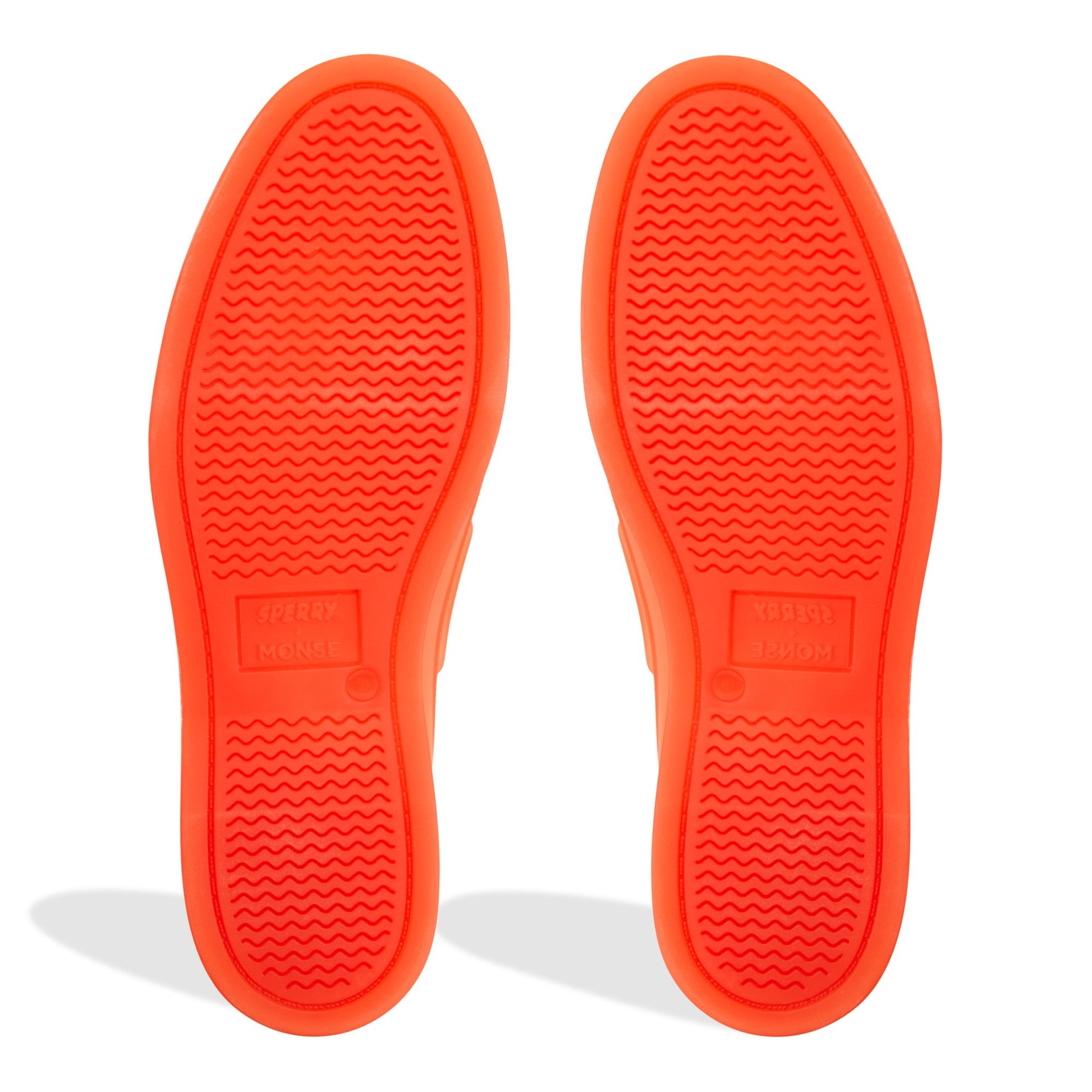 Close-up of the Bright orange Sperry x MONSE Authentic Original™ 2-Eye Jelly Boat Shoe