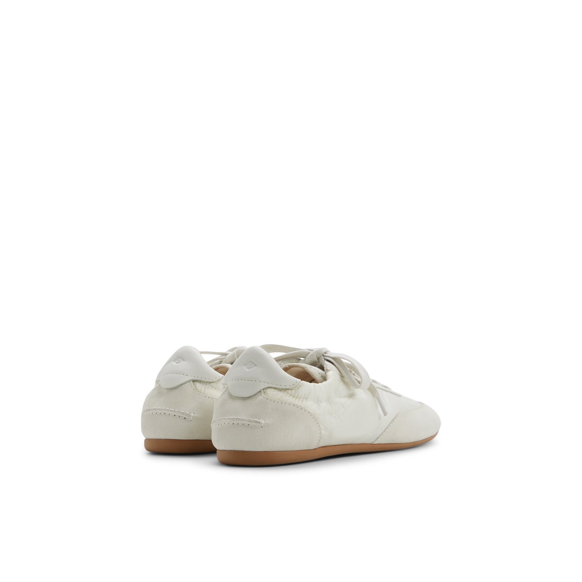 Three-quarter angle of Ivory Sperry x Aritzia Slim Jogger Low Top Sneakers's front side